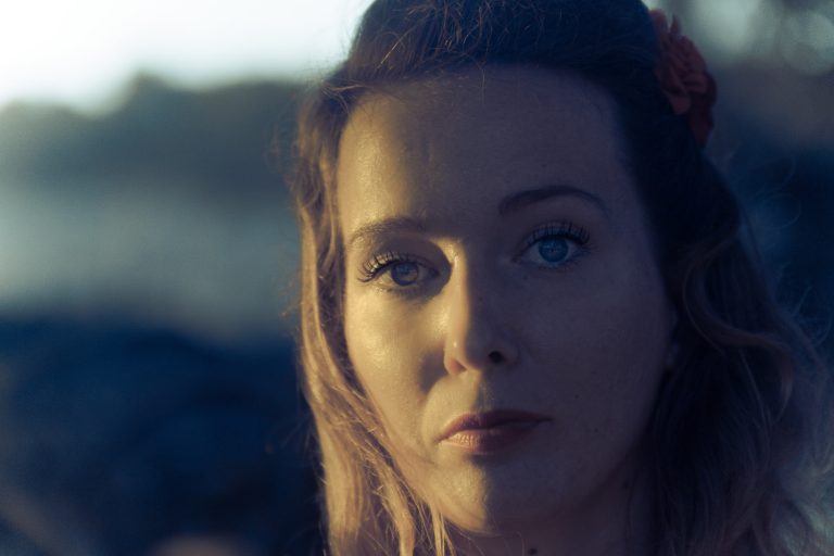Colour close-up portrait of a woman in warm evening light