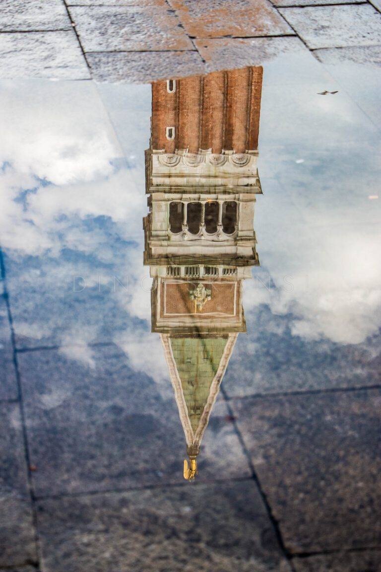 Reflection of St Mark's campanile in a puddle, Venice