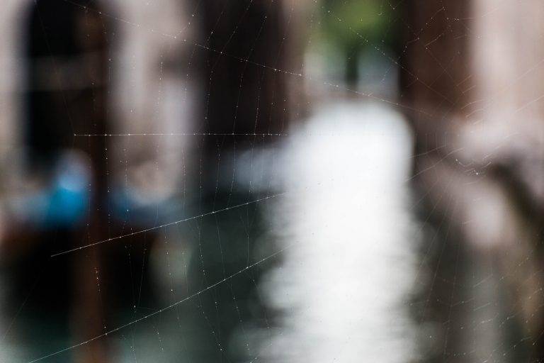 Blurred view down a narrow Venetian canal