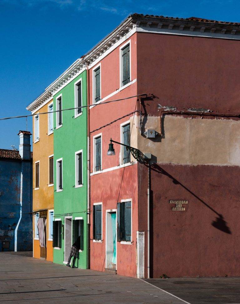 Brightly painted house facades in the Venice lagoon