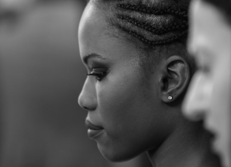 Black and white profile portrait of a woman with braided hair