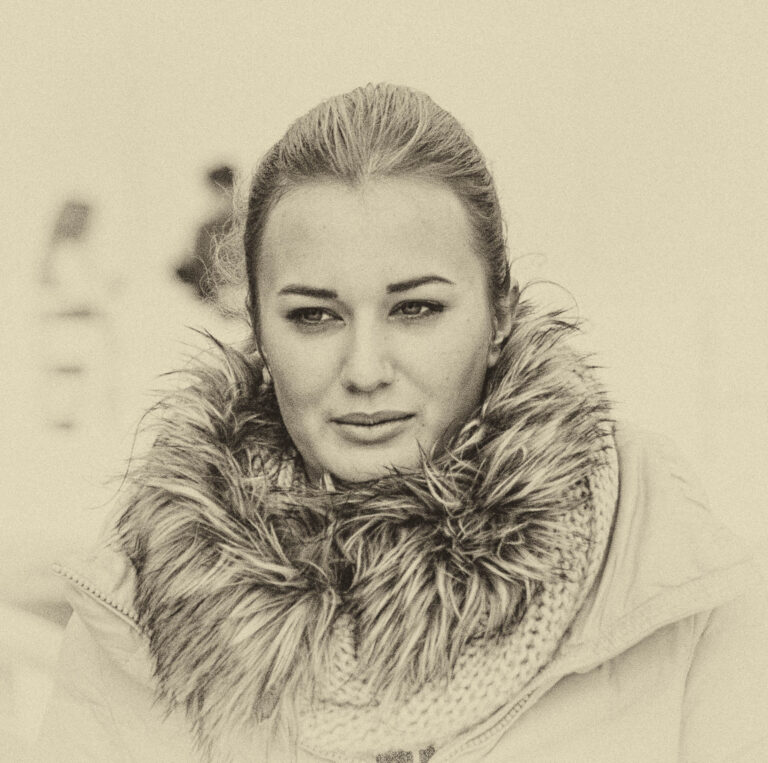 Sepia-toned portrait of a woman in a fur-collared coat
